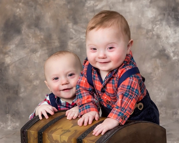 Twin boys at 9 months posing in the studio.