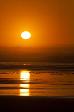 Sun setting on Heceta Beach near Florence, Oregon during February 2012
